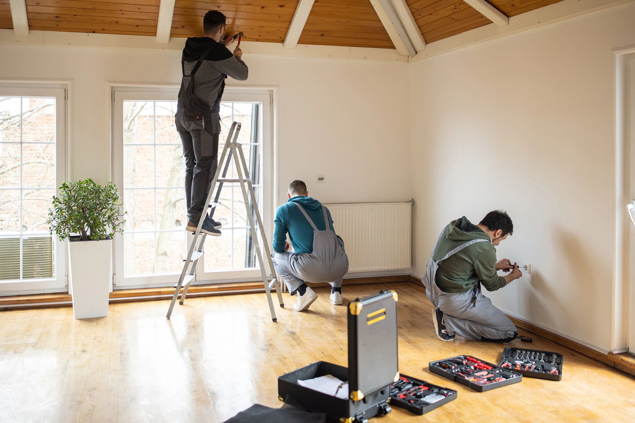 Construction professionals working inside a remodeling project