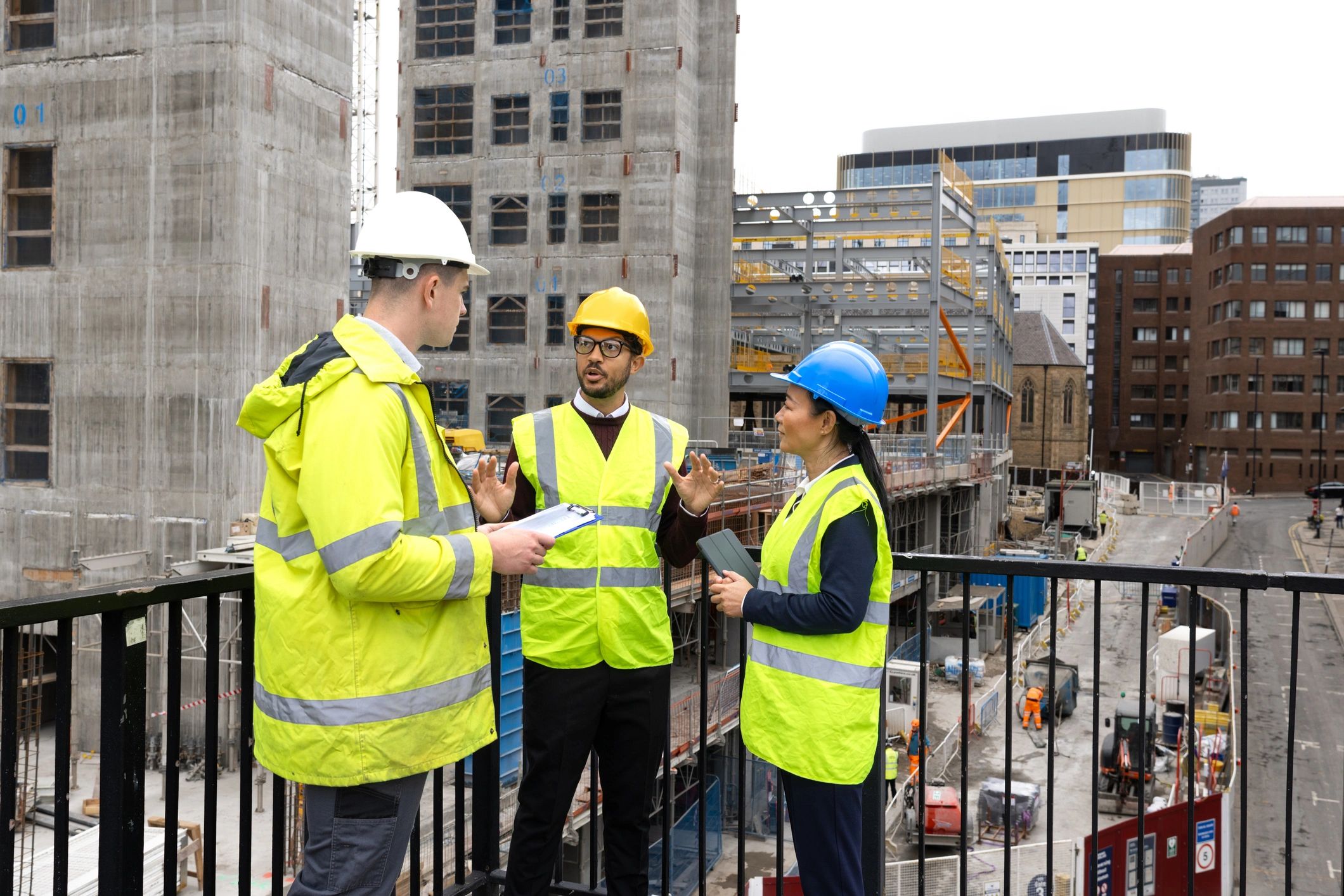 Construction leaders reviewing plans together